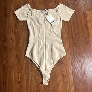 Zara Cream Short Sleeve One-Piece Bodysuit